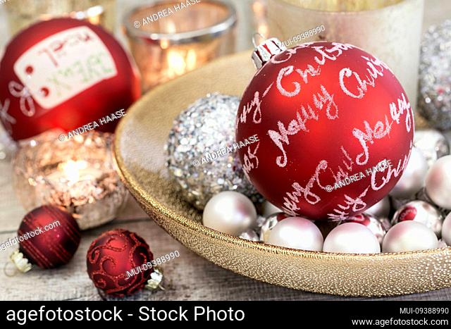 decorative Christmas still life in red and white with a ornament with text Merry Christmas