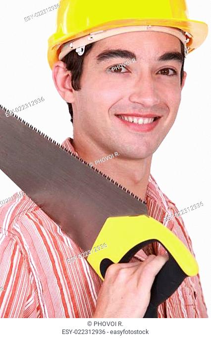 Young carpenter holding hand-saw