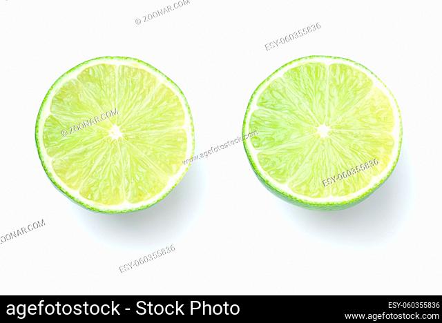 Sliced limes isolated on white background. Top view
