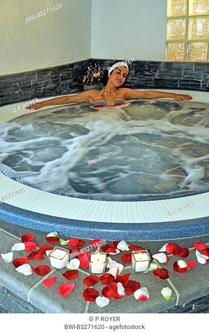 young woman relaxing in a whirl pool