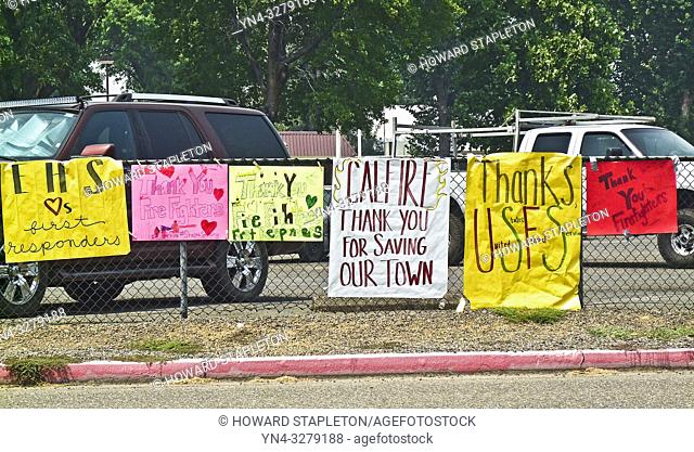 Signs on the perimeter of the Shasta County Fair Grounds in Anderson, California thanking firefighters and others working to contain the Carr Fire in Northern...
