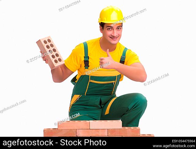 The the handsome construction worker building brick wall