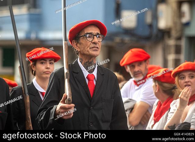 A man dressed in traditional costumes and wearing a shotgun parades through the street during the 'Alarde de San Marcial'. Irun (Spain). June 30, 2023