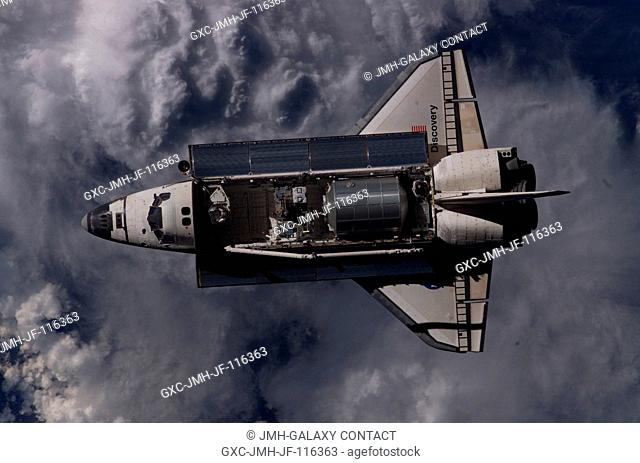 Overall view of the Space Shuttle Discovery as photographed during the survey operations performed by the Expedition 11 crew on the International Space Station...