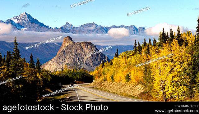 Mountains in the Chugach Range stand above the clouds rising from the Valley in Alaska North America