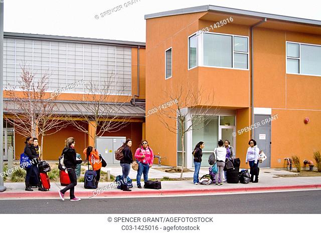 Students wait for a bus on Bobcat Lane outside the Yablokoff-Wallace Dining Center at the University of California, Merced  The campus is the tenth and newest...