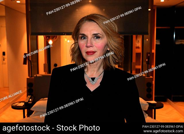 26 January 2023, Bavaria, Munich: Actress Valentina Sauca stands in front of a bed in a hotel room at the Hotel Andaz Munich Schwabinger Tor