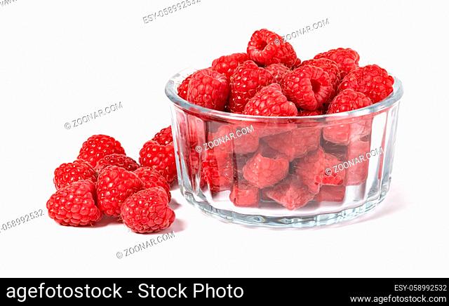 Raspberries in a bowl isolated on white background