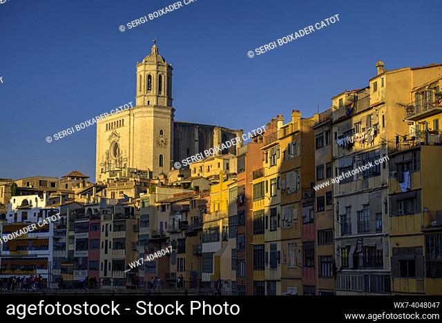 Girona Cathedral and houses next to the Onyar river at sunset (Girona, Catalonia, Spain)