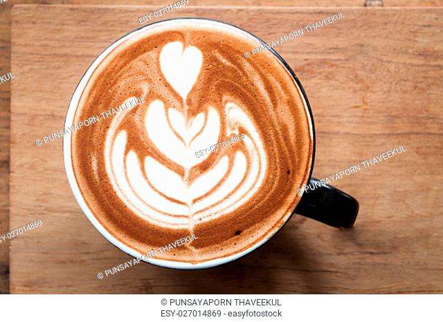 Top view of hot coffee on wooden table, stock photo