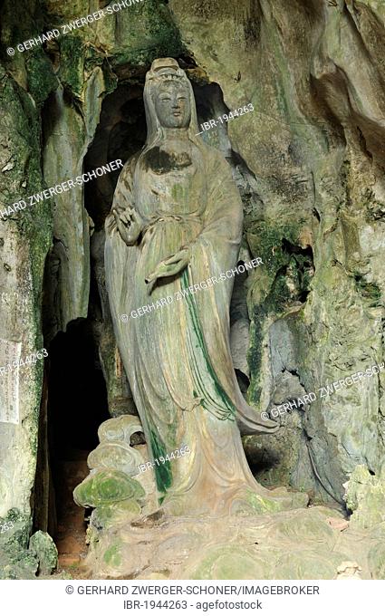Hoa Nghiem cave with statue of Quan Am, holding a fap lam bottle with wonder-working water in the left hand, Marble Mountains or Ngu Hanh Son, Thuy Son, Da Nang