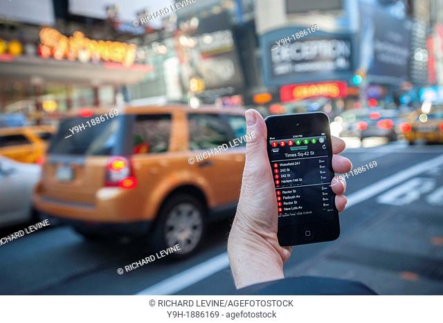 A subway rider checks the new MTA Subway Time app outside the Times Square station in New York Using the technology that is the engine behind the widely popular...