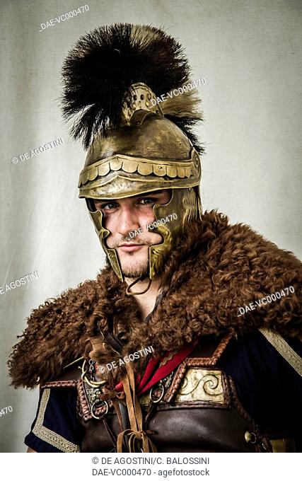 Ancient Greek general with helmet, cape and leather and metal plate armour. Historical reenactment. Detail