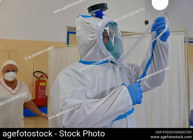 A soldier wears protective clothing in the Rehos follow-up rehabilitation and hospice care facilities in Nejdek, Czech Republic, on October 20, 2020