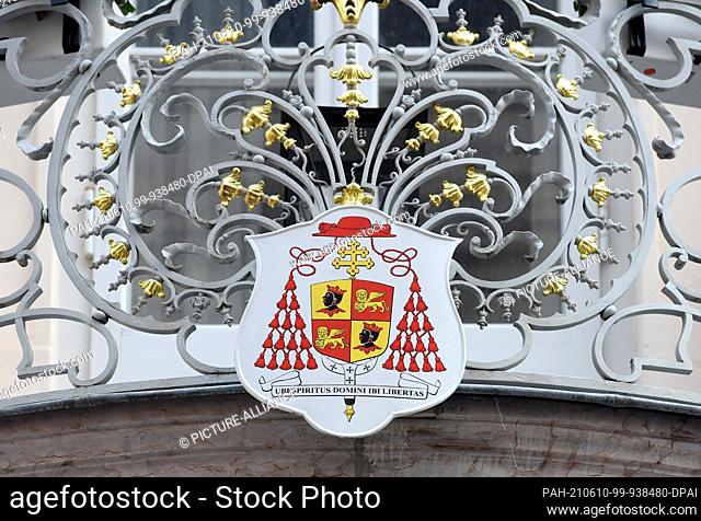 10 June 2021, Bavaria, Munich: A sign with a coat of arms and the inscription ""Ubi spiritus domini ibi libertas"" (There is freedom where the Spirit of the...