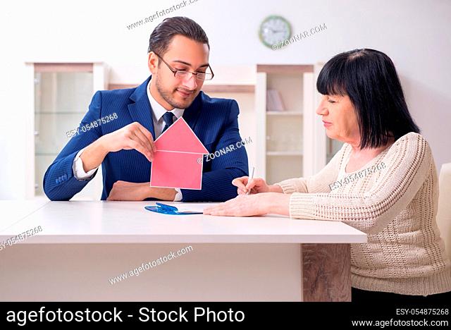 Male real estate agent and female client in the apartment