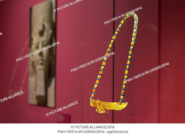 16 May 2019, Saarland, Völkingen: A royal pectoral with the representation of Nefertiti can be seen in the exhibition ""PharaonenGold - 3000 Jahre altägyptische...
