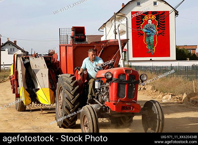Farmer driving a tractor near Lipjan, Kosovo