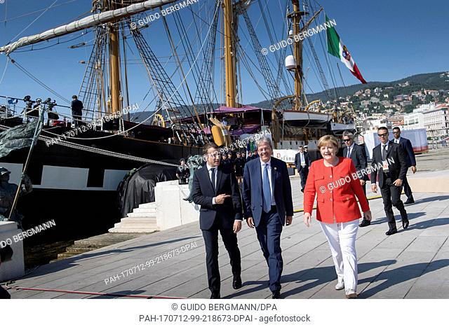 HANDOUT - Handout picture dated 12 July 2017 showing German Chancellor Angela Merkel (right to left), Italian Prime Minister Paolo Gentiloni and French...