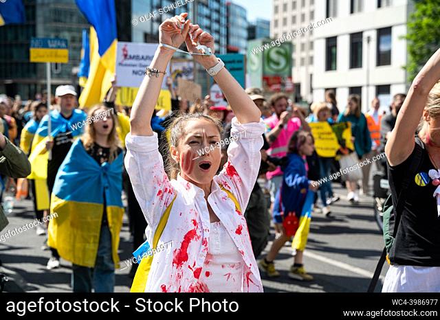 Berlin, Germany, Europe - Several hundred Ukrainian protesters, refugees, activists and supporters pass by Potsdamer Platz as they protest at a rally according...