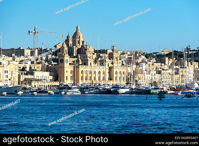 Valletta, Malta: Panoramic view over the harbor and coastal line with blue water and sky