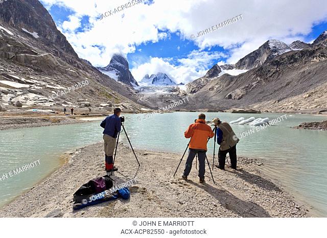 Landscape photographers taking pictures of the Vowell Glacier and Howser Tower in the Bugaboo Mountains, BC, Canada