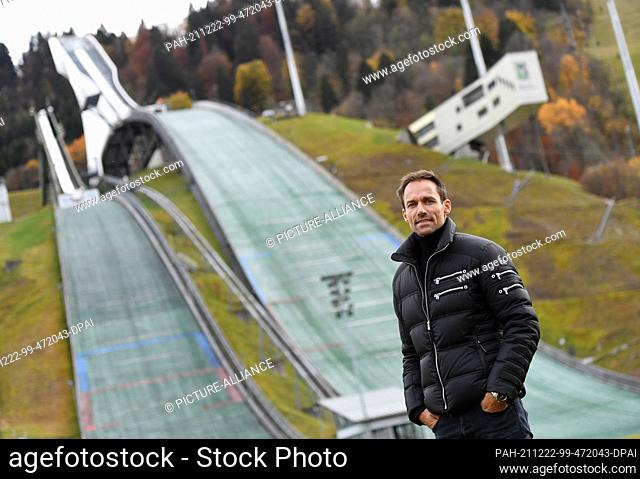 PRODUCTION - 03 November 2021, Bavaria, Garmisch-Partenkirchen: Sven Hannawald, former ski jumper, stands in the run-out of the ski jump