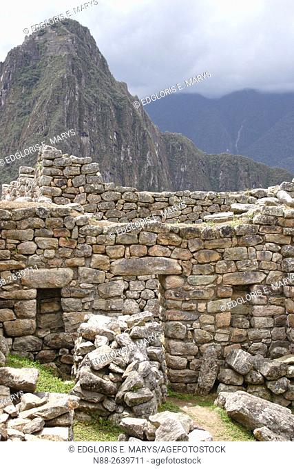 Detail of the ruins of Machu Picchu with a view of the mountain