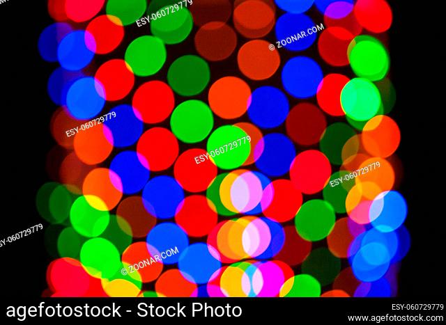 Multicolored defocused bokeh lights background. Abstract blurs