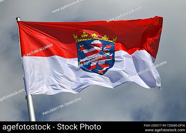 PRODUCTION - 16 May 2023, Hesse, Wiesbaden: The Hessian state service flag, the red and white state flag with the state coat of arms in the center