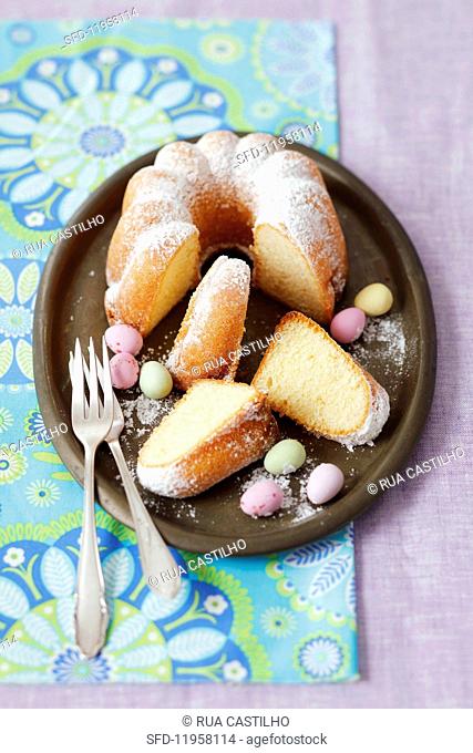 Lemon cake with icing sugar and chocolate eggs