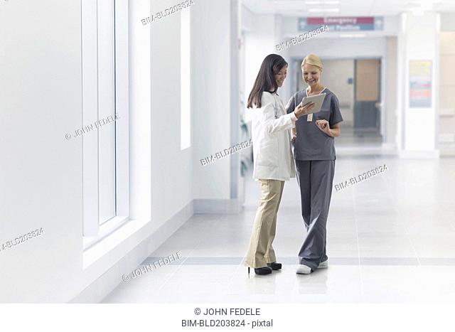 Doctor and nurse talking in hospital