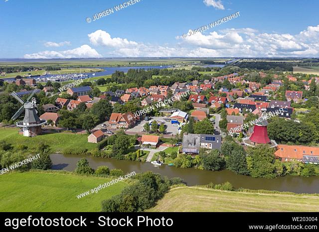 Drone view, city shot with the twin mills at the old Greetsieler Sieltief, Greetsiel, Lower Saxony, Germany, Europe