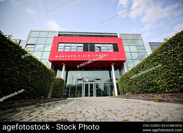 30 August 2023, Hamburg: Exterior view with ""Manfred Eigen Campus"" lettering on a building at the headquarters of the biotechnology company Evotec in the...