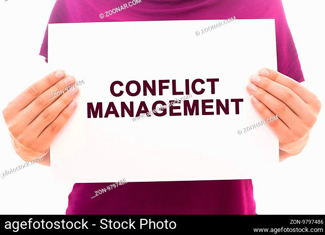 Girl holding white paper sheet with text Conflict management