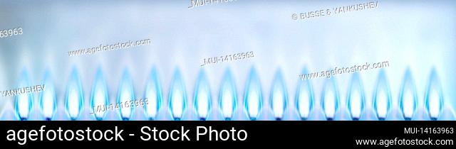 blue gas flames as a banner in front of a light background
