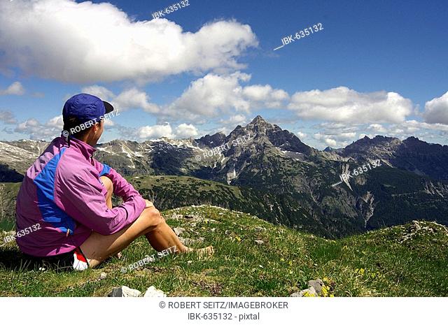 Mountain climber in front of the Allgaeuer Alps, Hinterhornbach, Tiol, Austria, Europe