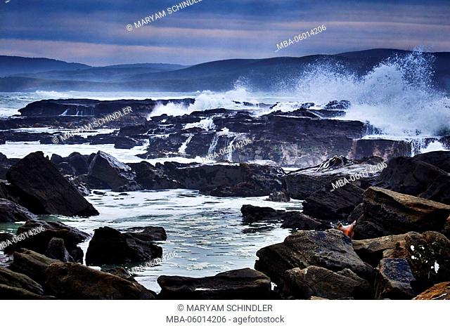 New Zealand, south island, southern scenic route, the catlins, jagged coast, waves whip against the rocks, gloomily