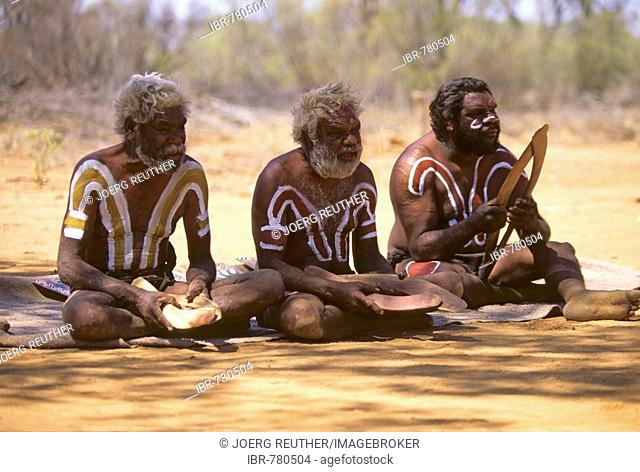 Aborigines, indegenous people of Australia holding boomerangs for hunting, Outback, Northern Territory, Australia