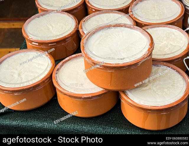 Kaymak, a creamy dairy product similar to cream, made from milk, in clay pots