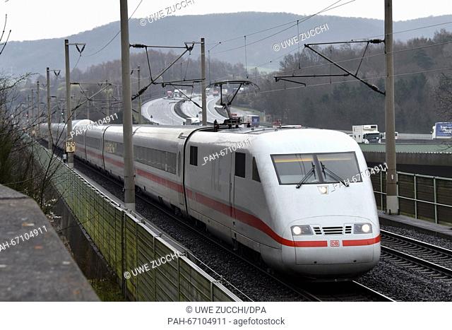 An ICE high-speed train rides over the Werra Bridge by the A7 highway between Kassel and Hanover near Hann. Muenden,  Germany, 31 March 2016