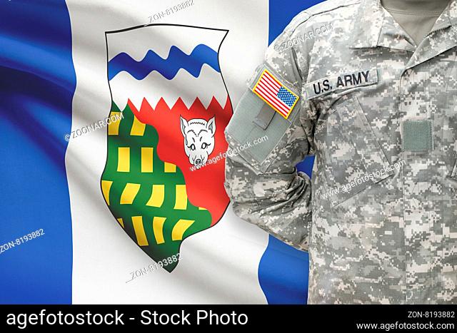 American soldier with Canadian province flag on background - Northwest Territories
