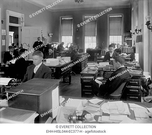 Men at desks in White House Executive Office, Dec. 23, 1908, Washington, D.C. They were working during the transition from Theodore Roosevelts to William Tafts...