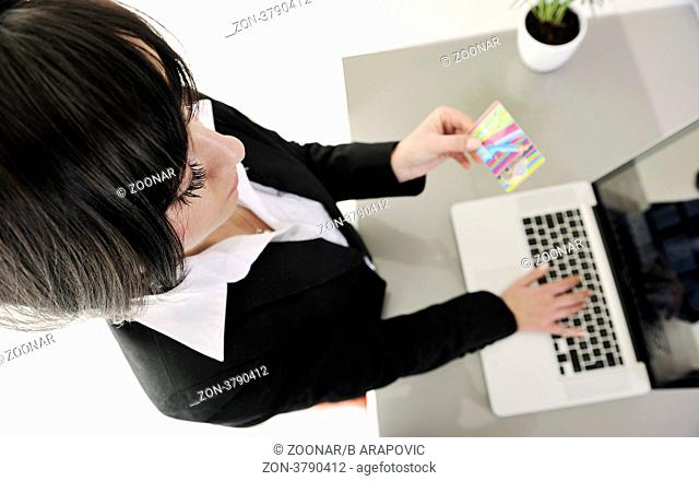 young business woman making online payment with credit card and representing concept of new age in banking and plastic money