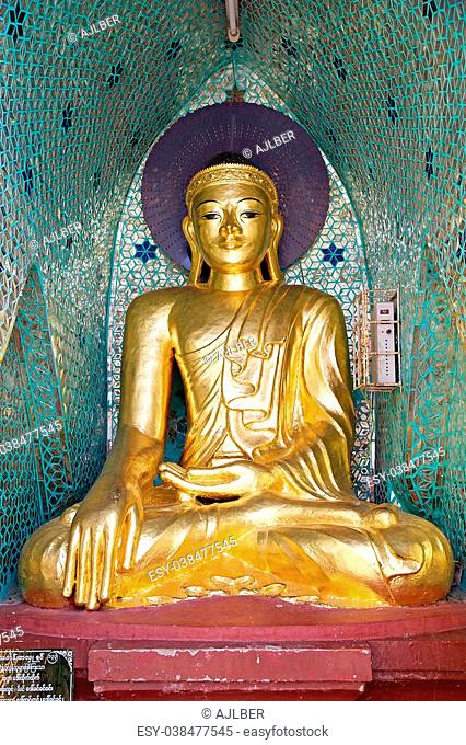 Buddha image at the Shwedagon Pagoda, a gilded stupa located in Yangon, Myanmar. The 99 metres tall pagoda is situated on Singuttare Hill