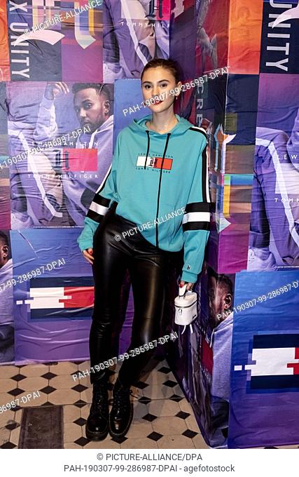07 March 2019, Berlin: Stefanie Giesinger, model, stands in front of a photo wall at the Tommy Hilfiger CREATExUNITY event