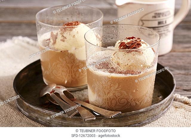 Cold cappuccino shakes in glasses with vanilla ice cream and grated chocolate
