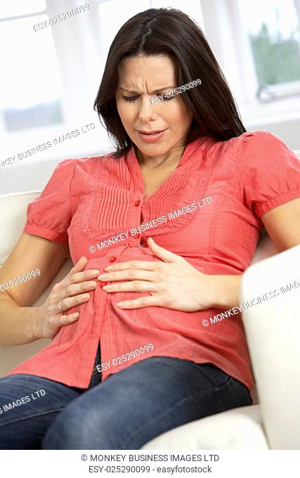 Concerned Pregnant Woman At Home