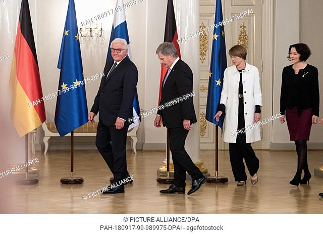 17 September 2018, Finland, Helsinki: Federal President Frank-Walter Steinmeier (l) and his wife Elke Büdenbender (2nd from right) are welcomed by Sauli...