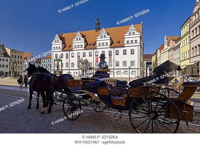 Market square with City Hall and coach in Wittenberg, Saxony-Anhalt, Germany